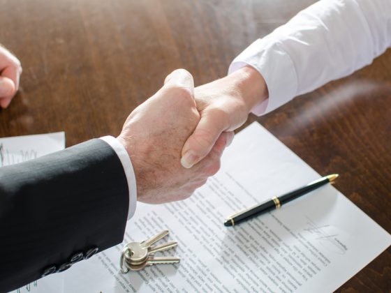 Agent Shaking Hands With His Client After Contract Signing